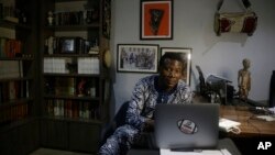 Writer and linguist Kola Tubosun, is photographed in his house in Lagos, Nigeria.on Nov. 24, 2021.