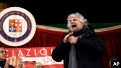 Comic-turned-politician and Five-Star movement's founder Beppe Grillo addresses a rally in Torre del Greco, near Naples, Italy, Feb. 12, 2018.