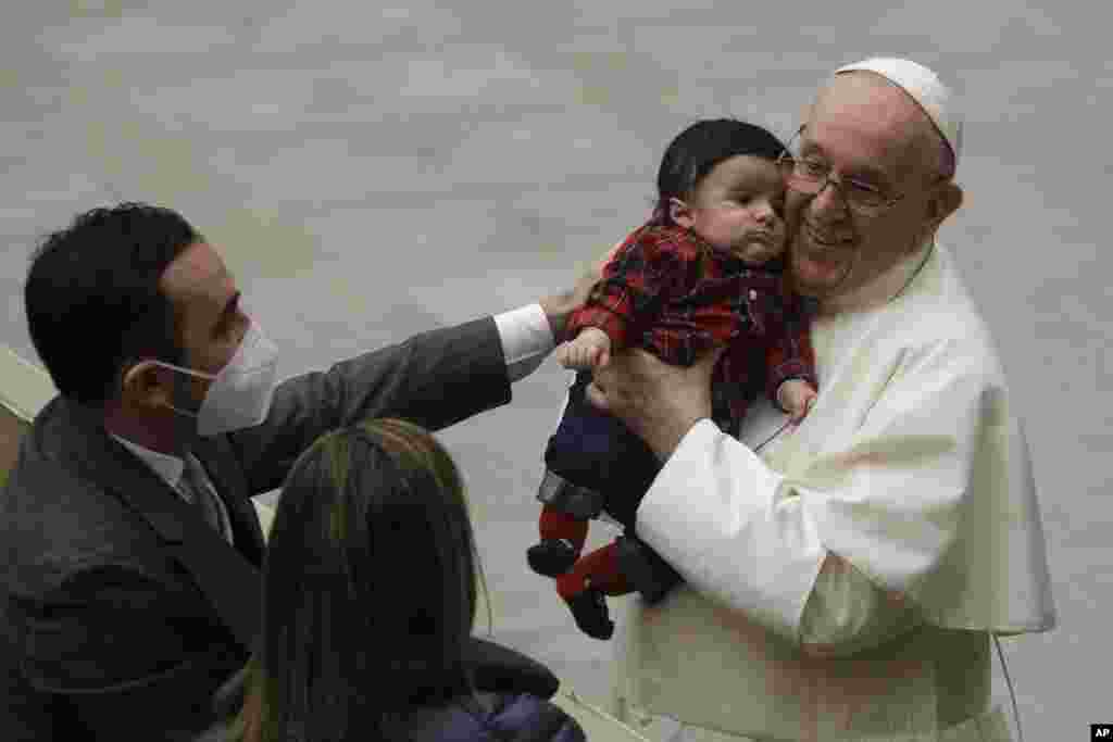 Pope Francis exchanges holidays greeting with Vatican employees in the Paul VI hall, Vatican City.