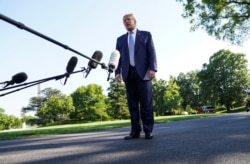U.S. President Donald Trump talks to reporters as he departs for the Camp David, Maryland presidential retreat from the South Lawn of the White House in Washington, May 15, 2020.