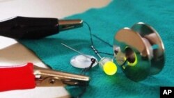 Illuminated lightbulb that uses Dr. Hinestroza's specially treated cotton threads as a conductor