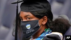 University of Pittsburgh history graduate Gina Watkins of Plainfield, NJ., attends her graduation ceremony in Pittsburgh, Tuesday, May 4, 2021. (AP Photo/Gene J. Puskar)