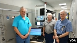 Gary Koster, Broadcast Radio Technician and transmitter expert, Gerhard Straub, Director USAGM Broadcast Technologies Division and Macon Dail, Chief Engineer, setting up a digital radio test at the Greenville, NC, Transmitting Station.