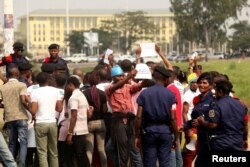 FILE - Congolese police detain protesters demanding that President Joseph Kabila leave power by the end of the year in Kinshasa, Democratic Republic of Congo, July 31, 2017.