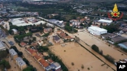 Scientists say extreme weather events like this flood in the city of Leghorn, Italy, following floods in September 2017 are becoming more common because of climate change.