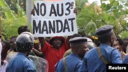 A protester holds a placard as they demonstrate against the ruling CNDD-FDD party's decision to allow Burundi President Pierre Nkurunziza to run for a third five-year term in office, in Bujumbura, May 4, 2015.