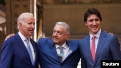 U.S. President Joe Biden, Mexican President Andres Manuel Lopez Obrador and Canadian Prime Minister Justin Trudeau pose at the conclusion of the North American Leaders' Summit in Mexico City, Mexico, Jan. 10, 2023. 