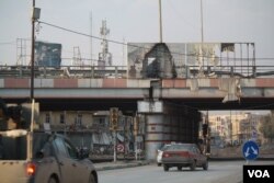 IS posters like this one are in tatters in Iraqi-controlled eastern Mosul. Residents say the public was terrified of the group and are relieved they have been forced out of the area, Jan. 28, 2017. (H. Murdock/VOA)