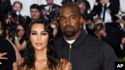 Kim Kardashian West, left, and Kanye West attend The Metropolitan Museum of Art's Costume Institute benefit gala celebrating the opening of the "Camp: Notes on Fashion" exhibition on May 6, 2019, in New York.