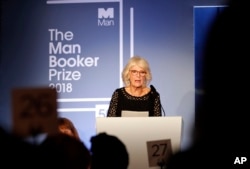 Britain's Camilla, the Duchess of Cornwall, addresses the guests during the Man Booker Prize for Fiction 2018, the prize's 50th year, at the Guildhall in London, Oct. 16, 2018.