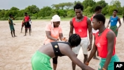 SenegaCoach Isabelle Sambou, 43, two-time Olympian and nine-time African wrestling champion, left, talks to young women during a wrestling training session in Mlomp, southern Senegal, July 10, 2024.