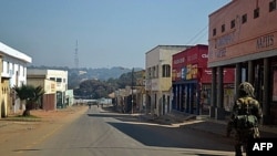 A Malawian soldier patrols the deserted streets of Lilongwe, on July 21, 2011, a day after mass protests against Malawi's President Bingu wa Mutharika.