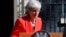 British Prime Minister Theresa May reacts as she turns away after making a speech in the street outside 10 Downing Street in London, England, May 24, 2019. 