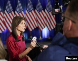 FILE - Republican presidential candidate and former U.S. Ambassador to the United Nations Nikki Haley speaks to the media at a caucus night party in West Des Moines, Iowa, U.S., January 15, 2024.