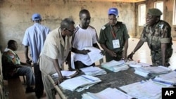 Guinean election officials tabulate some election results at Matoto's city hall in Conakry, Guinea, 09 Nov 2010