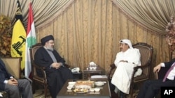 Lebanon's Hezbollah leader Sayyed Hassan speaks with Qatar's Prime Minister and Foreign Minister Sheikh Hamad, as Turkey's Foreign Minister Davutogluat and Hezbollah official al-Khalil listen during their meeting in Beirut, 19 Jan 2011