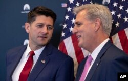 FILE - Speaker of the House Paul Ryan, R-Wis., left, and Majority Leader Kevin McCarthy, R-Calif., confer during a news conference on a defense funding bill moving in the House, at the Capitol in Washington, Sept. 26, 2018.