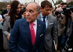 FILE - White House chief economic adviser Larry Kudlow talks with reporters outside the White House, April 4, 2018, in Washington.