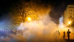 Tear gas is seen as demonstrators rally near the White House against the death in Minneapolis police custody of George Floyd in Washington, D.C. U.S. May 30, 2020. REUTERS/Eric Thayer