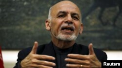 Afghanistan's President Ashraf Ghani speaks during a news conference in Kabul, Afghanistan, Dec. 31, 2015. 