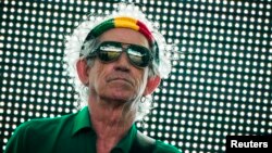 FILE - Keith Richards of the Rolling Stones performs during their "14 on Fire" show at Waldbuehne in Berlin, June 10, 2014. 