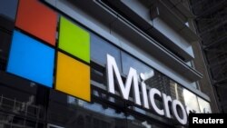 FILE - A Microsoft logo is seen on an office building in New York City, July 28, 2015.