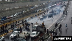 FILE - People protest against increased gas price, on a highway in Tehran, Iran, November 16, 2019. 