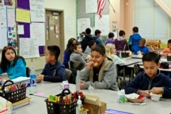 Students eating breakfast in class