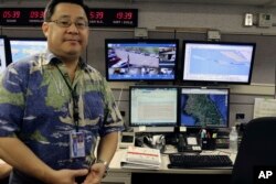 Jeffrey Wong, the Hawaii Emergency Management Agency's current operations officer, shows computer screens monitoring hazards at the agency's headquarters in Honolulu, July 21, 2017. Hawaii is the first state to prepare the public for the possibility of a North Korean missile strike.