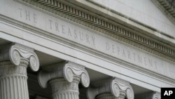 FILE - The U.S. Treasury building is seen in Washington, May 4, 2021. On Aug. 15, 2022, the Treasury imposed sanctions on three Liberian government officials for alleged corruption. 