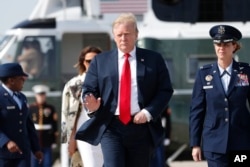 President Donald Trump and first lady Melania Trump walk from Marine One helicopter to board Air Force One, April 18, 2019, at Andrews Air Force Base, Md.