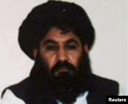 FILE - Mullah Akhtar Mansoor is seen in this undated handout photo from the Taliban.