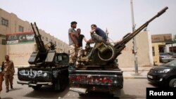 Armed revolutionaries stage protest in front of the Libyan Justice Ministry, Tripoli, April 30, 2013.