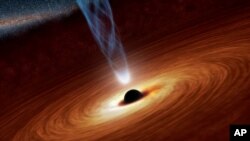 A supermassive black hole with millions to billions times the mass of our sun is seen in an undated NASA artist's concept illustration.