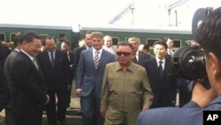 North Korean leader Kim Jong-il takes part in a welcoming ceremony on his arrival in Novoburesky in Amur province, August 21, 2011.