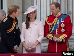 Prince Harry (L), Prince William (R) and Catherine, Duchess of Cambridge stand on the balcony of Buckingham Palace after the Trooping the Colour ceremony in central London, England, June 15, 2013.