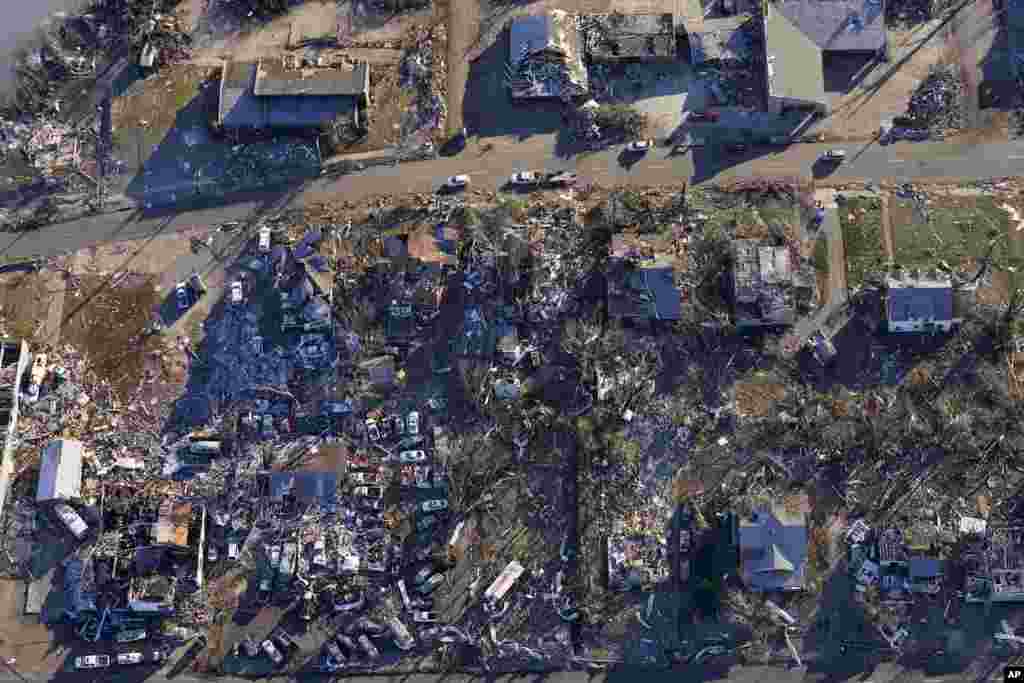 In this aerial photo, destruction from a recent tornado is seen in downtown Mayfield, Kentucky.&nbsp;Governor Andy Beshear is warning the state&rsquo;s death toll from an outbreak of tornadoes could top 100.&nbsp;