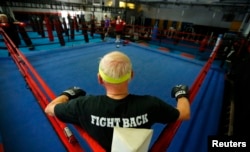 FILE - A Parkinson's patient waits for his training session in the ring during his Rock Steady Boxing session in Costa Mesa, California, Sept. 16, 2013.