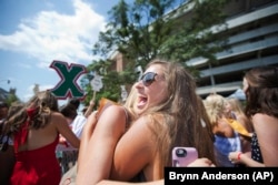 Alpha Chi Omega's new member, Ella Finley's, right, hugs her "big sis" Kaytlyn Carlson, left, during the University of Alabama sorority Bid Day, Saturday, August 19, 2017, in Tuscaloosa, Alabama.