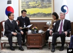 FILE - South Korean Unification Minister Cho Myoung-gyon (L) talks with U.S. special representative for North Korea Stephen Biegun, (R) during a meeting at the government complex in Seoul, South Korea, Oct. 30, 2018.