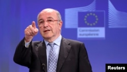 FILE - European Union Competition Commissioner Joaquin Almunia addresses a news conference at the EU Commission headquarters in Brussels.
