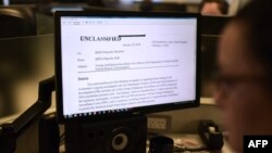 The Republican intelligence memo alleging FBI abuse of power in probing Russian interference in the 2016 election is displayed on a journalist's computer screen in Washington DC, on February 2, 2018.