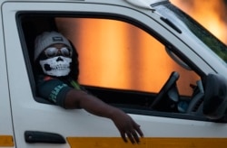 A taxi driver wearing a face mask in Kwa-Thema east of Johannesburg, South Africa.