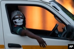 A taxi driver wearing a face mask in Kwa-Thema east of Johannesburg, South Africa.