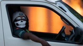 A taxi driver wearing a face mask in Kwa-Thema east of Johannesburg, South Africa.