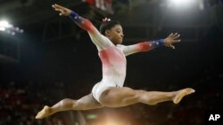 FILE - United States' Simone Biles performs on the balance beam during the gymnastics exhibition gala at the 2016 Summer Olympics in Rio de Janeiro, Brazil, Aug. 17, 2016. Biles' medical information was hacked and posted online.