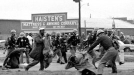 FILE - Alabama state troopers use clubs against voting rights marchers in Selma on March 7, 1965. At foreground right, John Lewis, chairman of the Student Nonviolent Coordinating Committee, is beaten. (Associated Press)