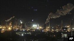 Smoke bellows out of chimney stacks at BlueScope Steel's steelworks at Port Kembla, south of Sydney, Australia, (File)