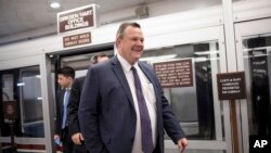 FILE - Sen. Jon Tester, D-Mont., arrives for final votes for the week, at the Capitol in Washington, Jan. 25, 2018.
