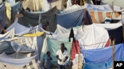 A camp of makeshift tents sprawls at Port-au-Prince's golf course, where many Haitians displaced by the earthquake have set up shelter, 25 Jan 2010